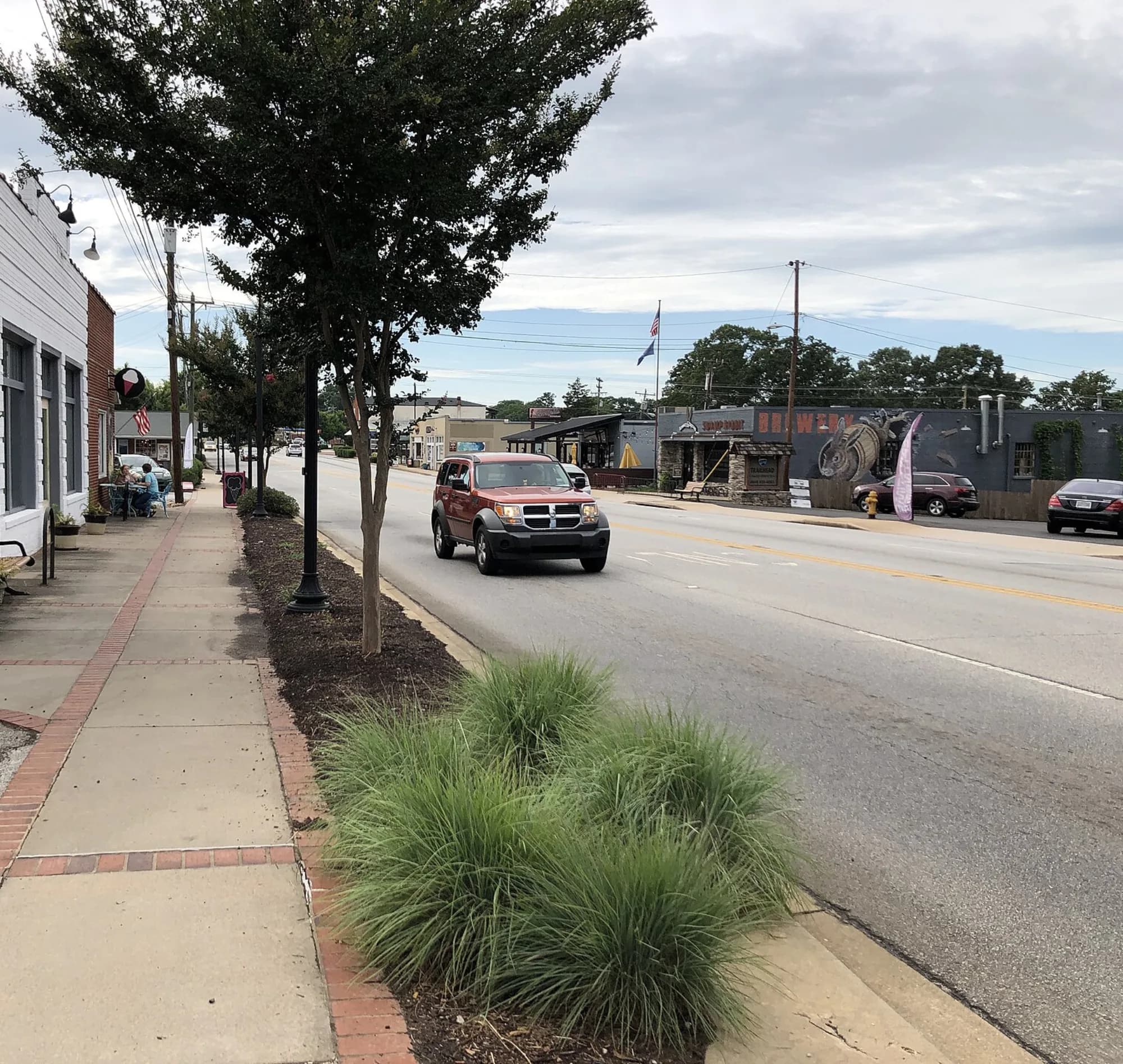 Main Street in downtown Travelers Rest, storefronts and the Swamp Rabbit Brewery