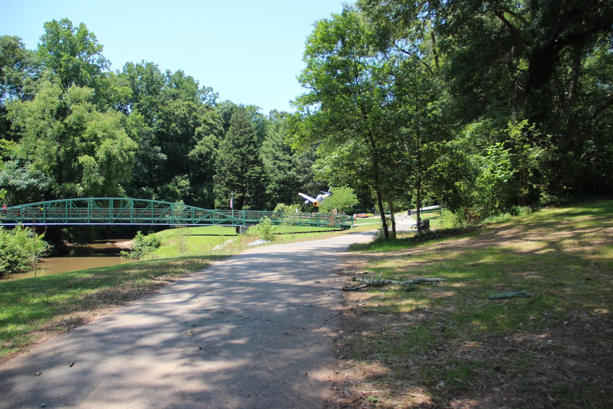 The paved Swamp Rabbit Trail running beside the Reedy River